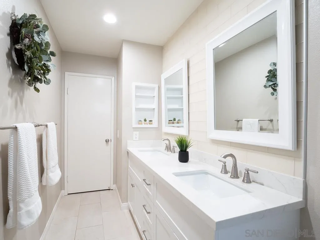 14018 Twin Peaks Road Poway, CA 92064 - Photo 19 of 27 a bathroom with a sink and a mirror