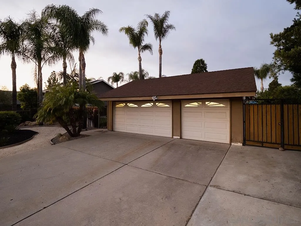 14018 Twin Peaks Road Poway, CA 92064 - Photo 26 of 27 a front view of a house with a yard and garage