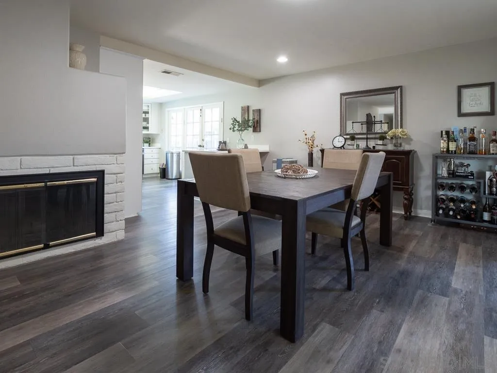 14018 Twin Peaks Road Poway, CA 92064 - Photo 4 of 27 a view of a dining room with furniture and wooden floor