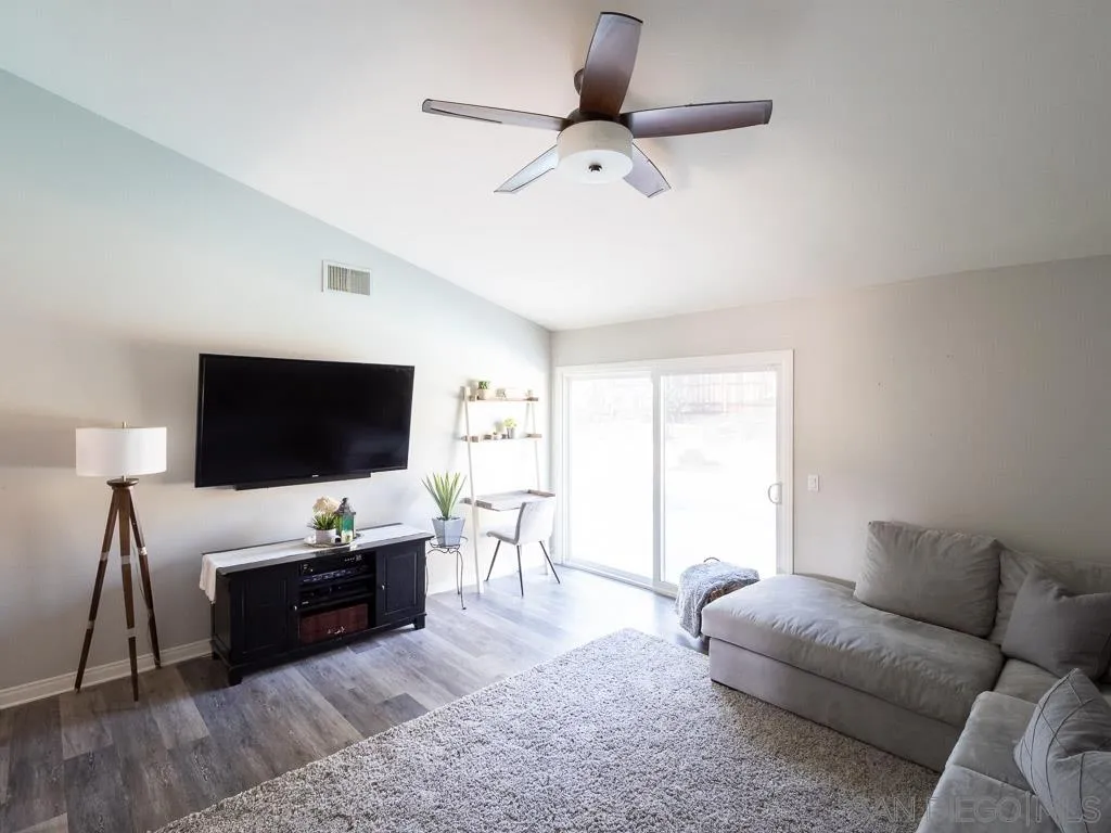 14018 Twin Peaks Road Poway, CA 92064 - Photo 7 of 27 a living room with furniture and a flat screen tv