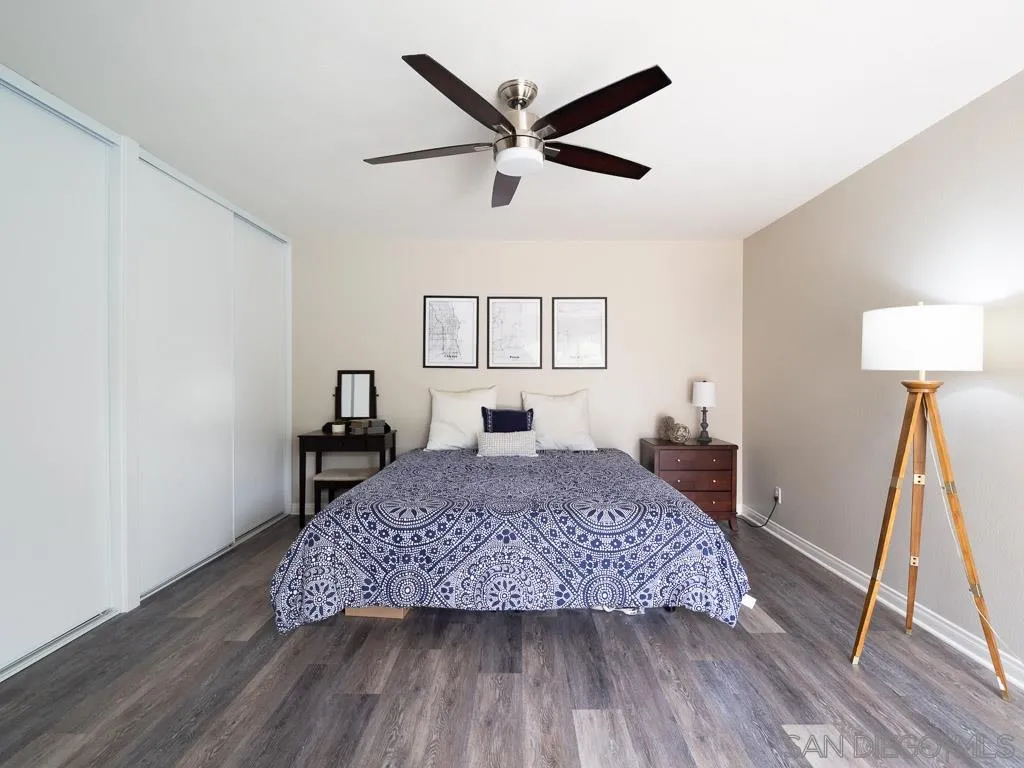 14018 Twin Peaks Road Poway, CA 92064 - Photo 8 of 27 a living room with a bed furniture and a wooden floor