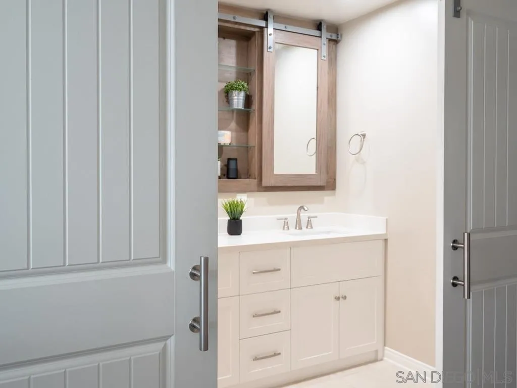 14018 Twin Peaks Road Poway, CA 92064 - Photo 10 of 27 a bathroom with a sink and a mirror