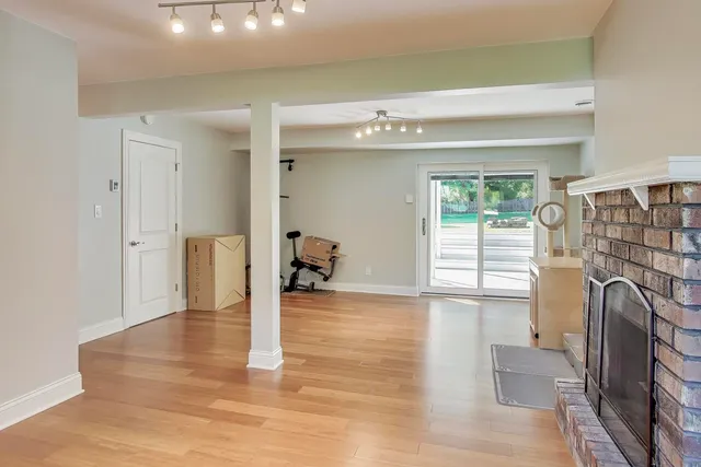 a view of a livingroom with furniture and staircase