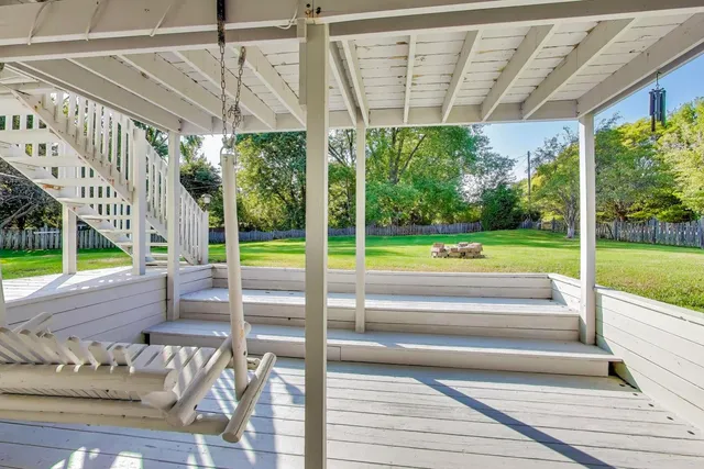 a view of a swimming pool with a porch