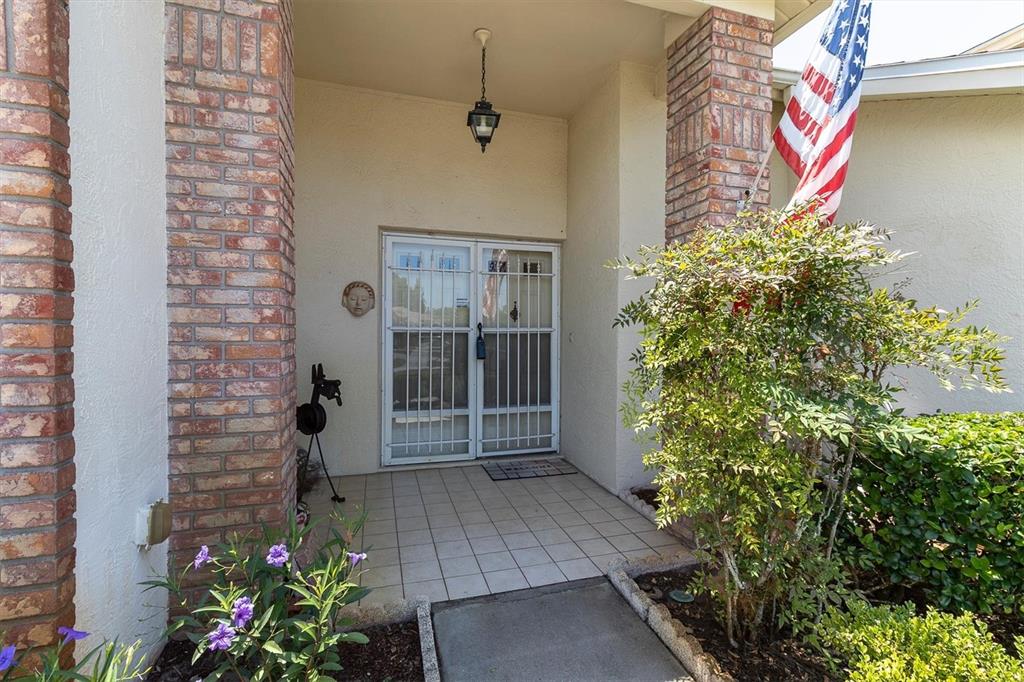 9052 Arundle Place New Port Richey, FL 34655 - Photo 2 of 57 a view of a house with potted plants