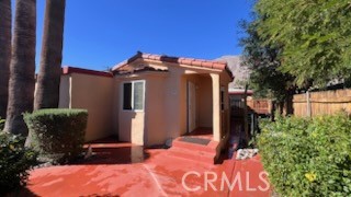 583 Calle Abronia South, Unit A Palm Springs, CA 92264 - Photo 1 of 19 a view of entryway with garden