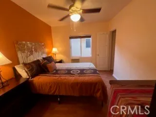 a bedroom with bed and window