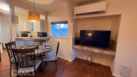 a view of a livingroom with furniture and a flat screen tv