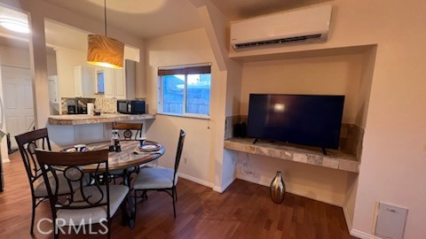 583 Calle Abronia South, Unit A Palm Springs, CA 92264 - Photo 4 of 19 a view of a livingroom with furniture and a flat screen tv