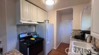 a kitchen with a stove and a cabinet