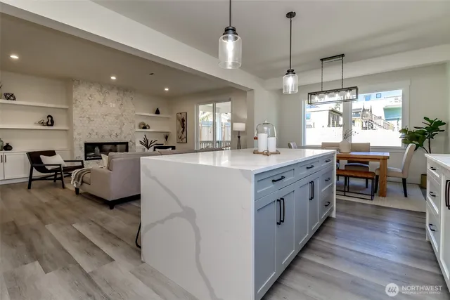 a kitchen with counter top space a sink appliances and cabinets