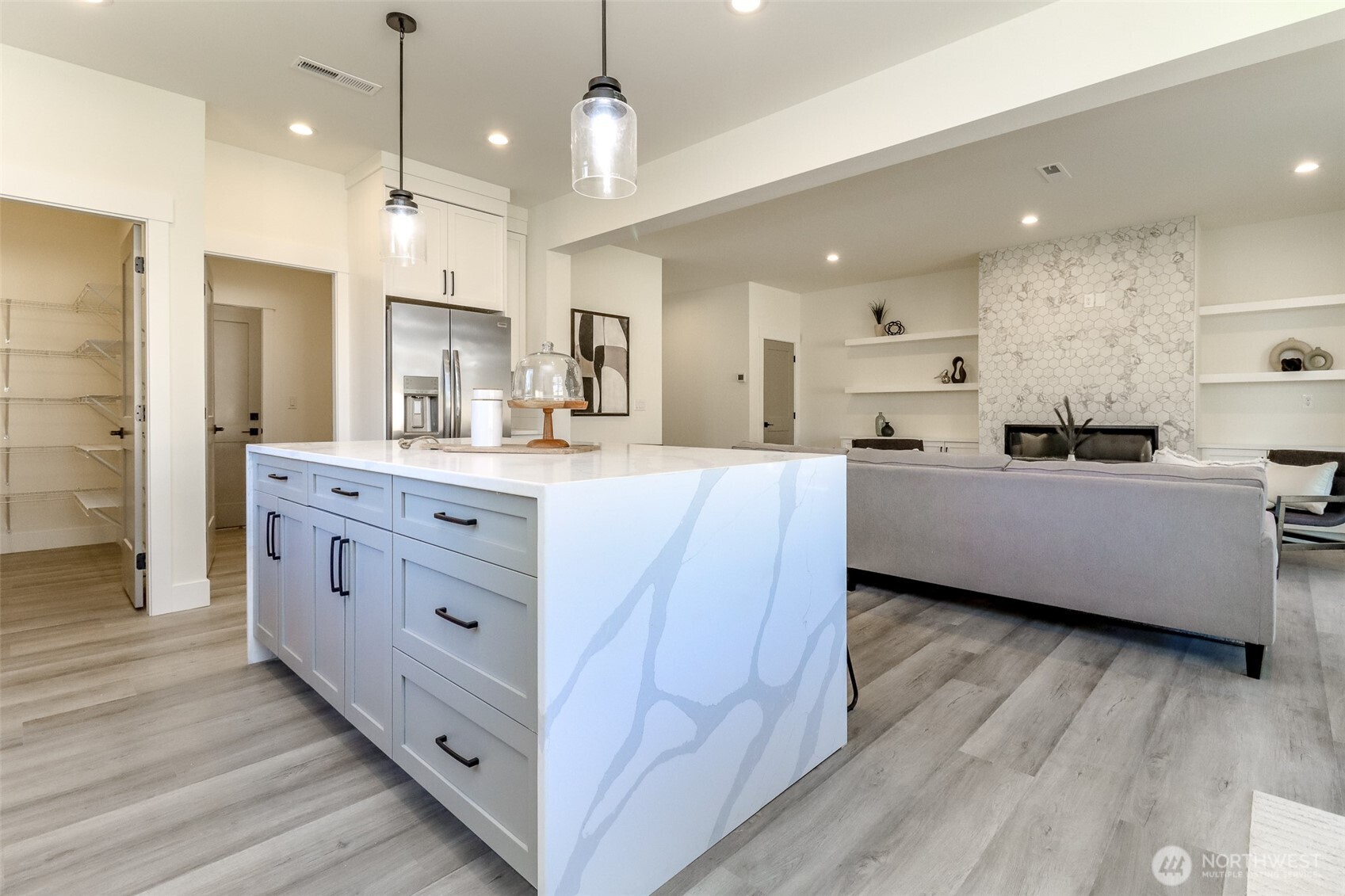 124 South 108th Place Seattle, WA 98168 - Photo 13 of 38 a large kitchen with kitchen island a island a sink stainless steel appliances and cabinets
