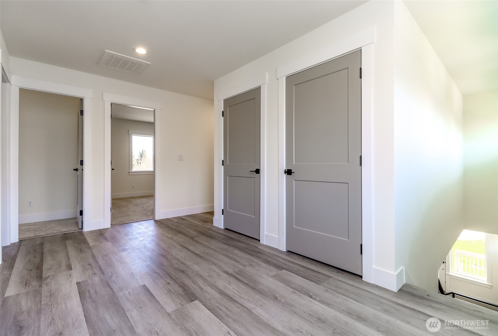 124 South 108th Place Seattle, WA 98168 - Photo 18 of 38 an empty room with wooden floor & windows