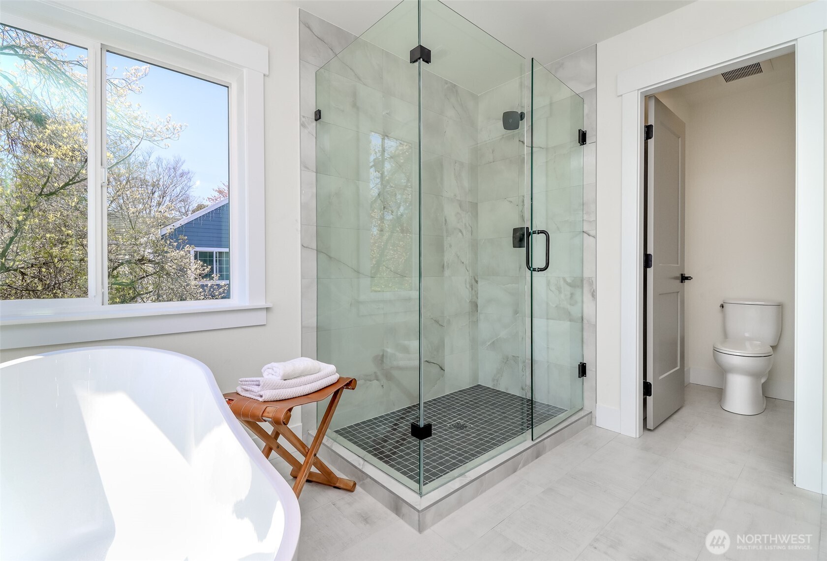 124 South 108th Place Seattle, WA 98168 - Photo 23 of 38 a bathroom with a shower and a toilet sink