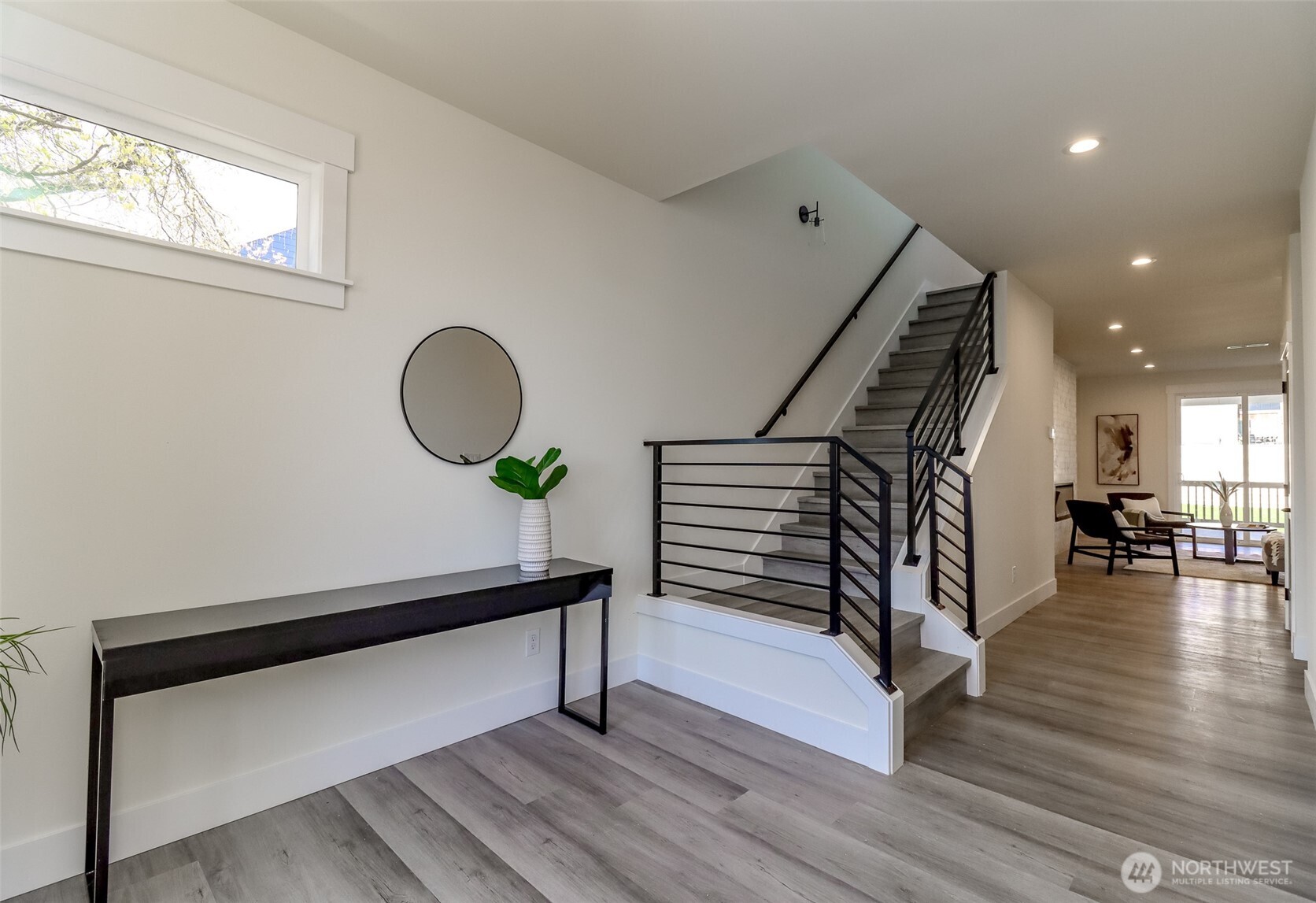 124 South 108th Place Seattle, WA 98168 - Photo 3 of 38 a view of entryway and hall with wooden floor