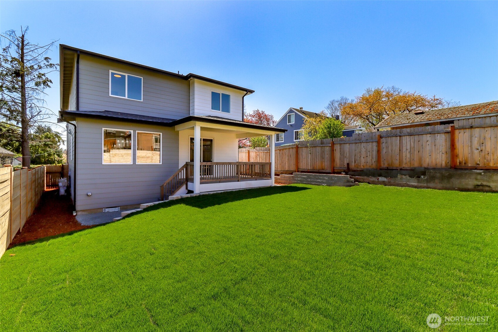 124 South 108th Place Seattle, WA 98168 - Photo 37 of 38 a front view of a house with a yard