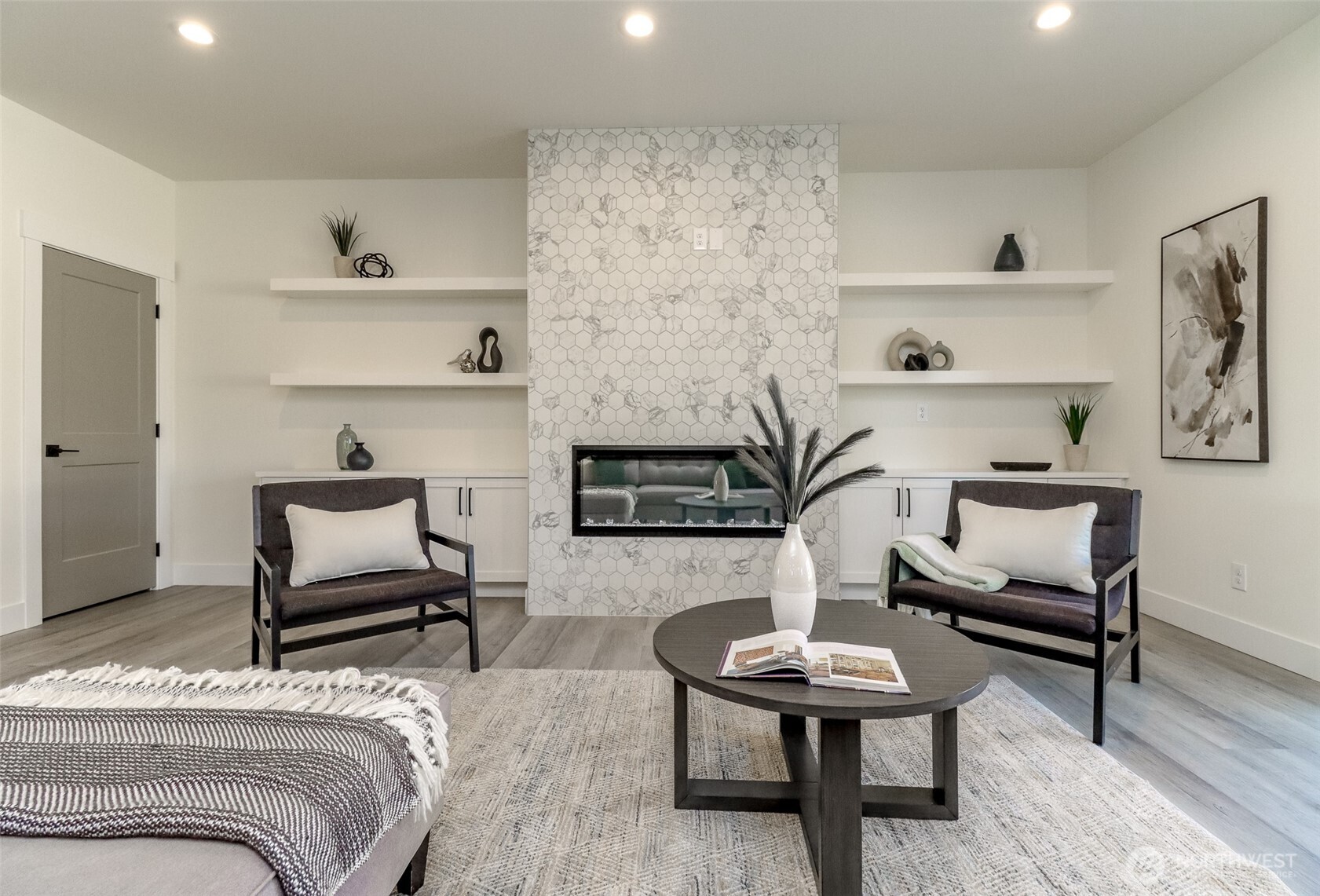 124 South 108th Place Seattle, WA 98168 - Photo 7 of 38 a bedroom with furniture and a wooden floor