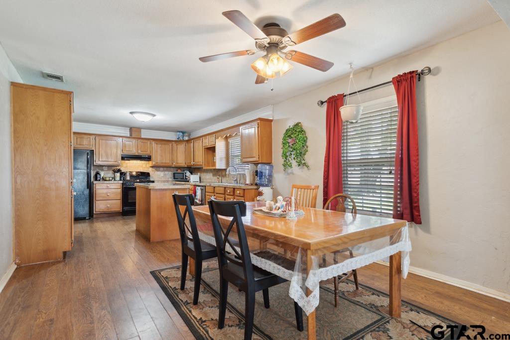 301 Bascom Road Whitehouse, TX 75791 - Photo 13 of 31 a view of a dining room with furniture and a chandelier