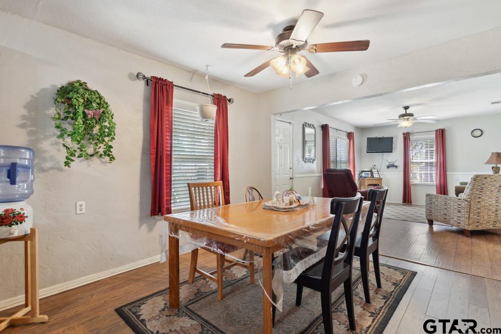 301 Bascom Road Whitehouse, TX 75791 - Photo 15 of 31 a view of a dining room with furniture and wooden floor
