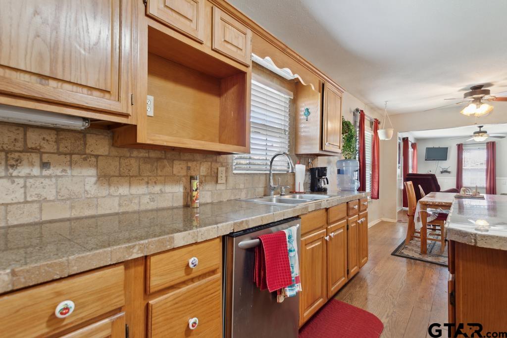301 Bascom Road Whitehouse, TX 75791 - Photo 20 of 31 a kitchen with stainless steel appliances granite countertop a sink stove and cabinets