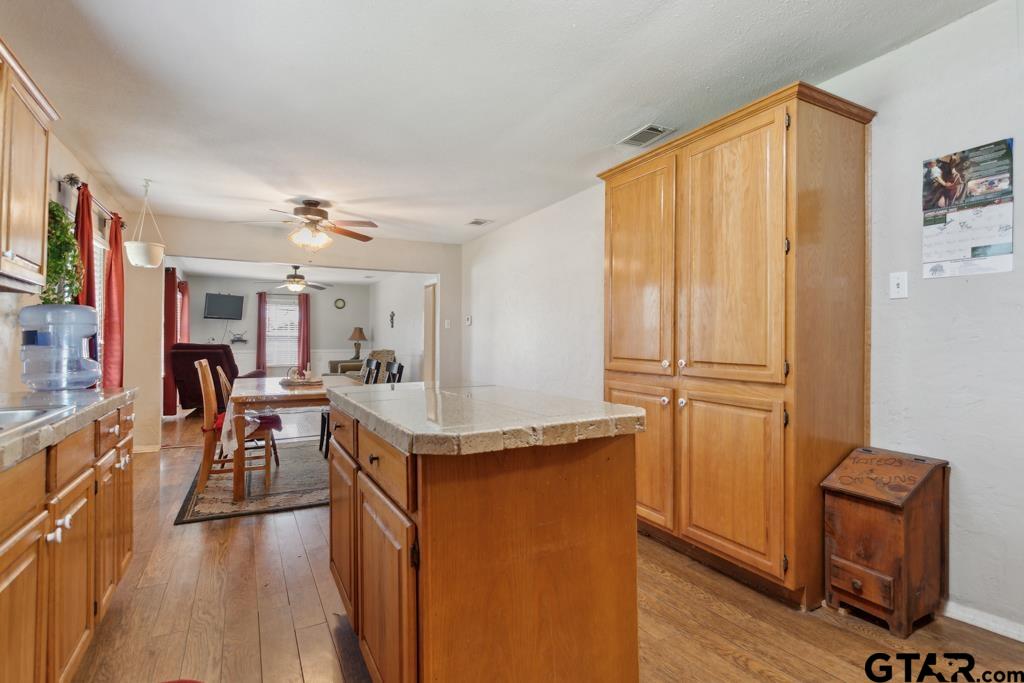 301 Bascom Road Whitehouse, TX 75791 - Photo 21 of 31 a very nice looking dining room with wooden floor and furniture