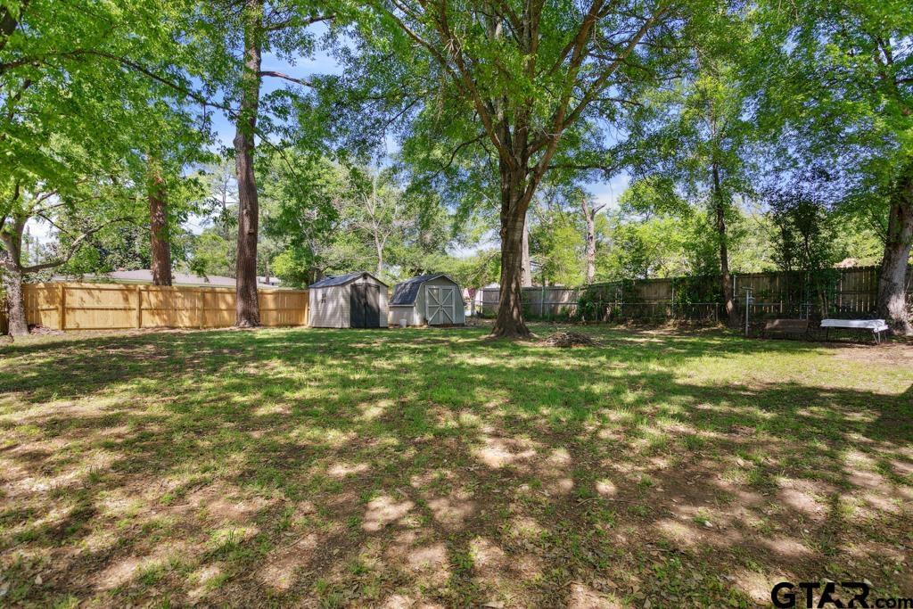 301 Bascom Road Whitehouse, TX 75791 - Photo 22 of 31 a view of a backyard with large trees