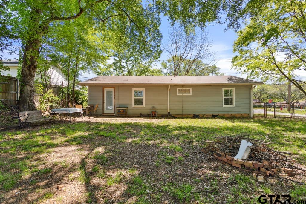 301 Bascom Road Whitehouse, TX 75791 - Photo 26 of 31 a view of a house with backyard and a garden