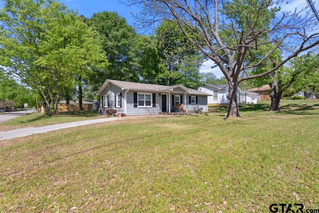301 Bascom Road Whitehouse, TX 75791 - Photo 29 of 31 a front view of a building with a garden and trees