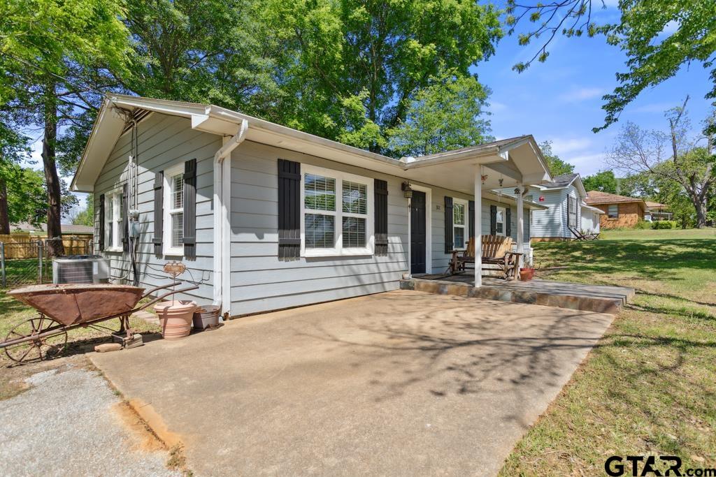 301 Bascom Road Whitehouse, TX 75791 - Photo 31 of 31 a backyard of a house with yard and outdoor seating