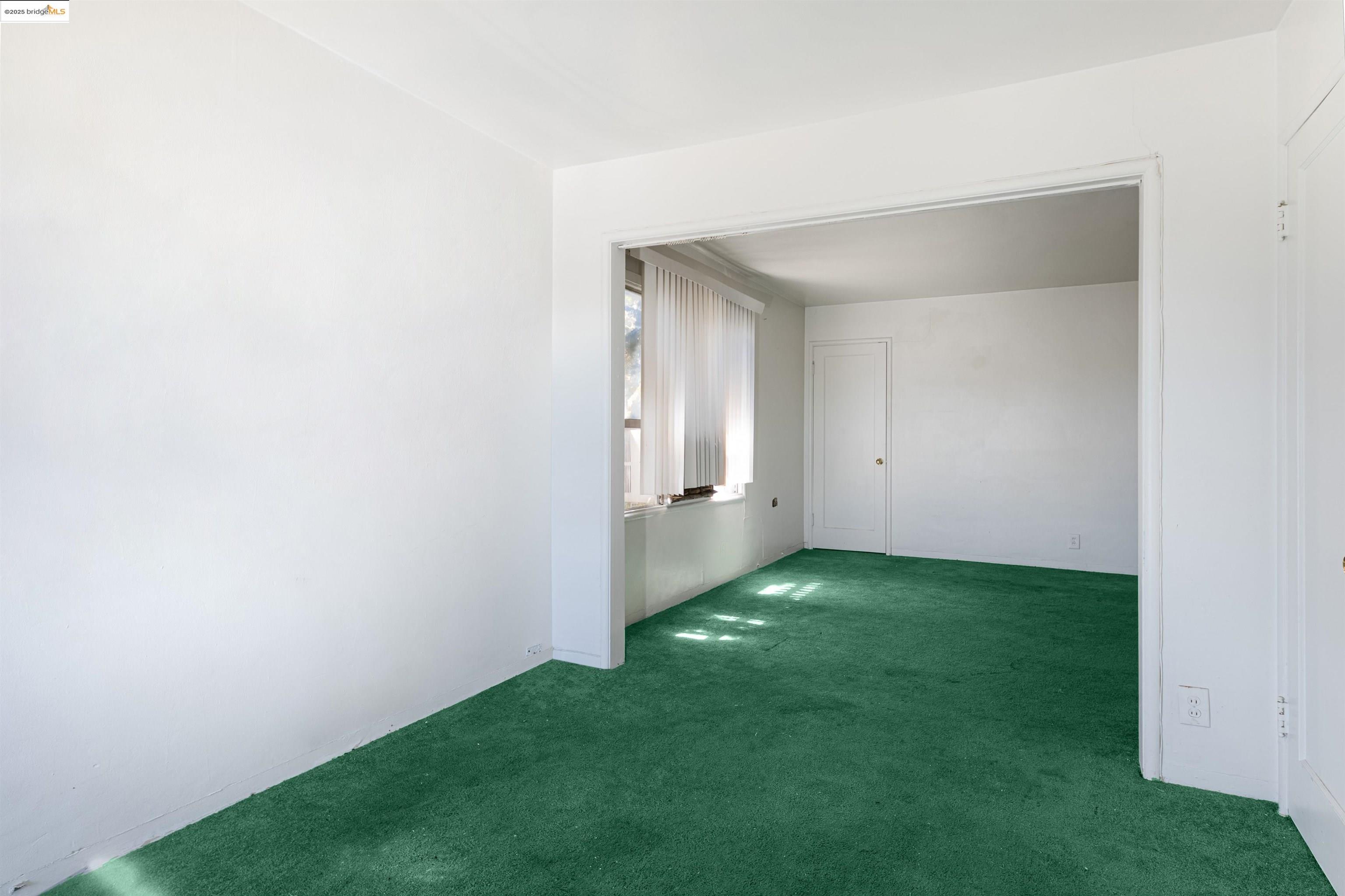 1427 65th Avenue Oakland, CA 94621 - Photo 6 of 13 a view of an empty room with closet