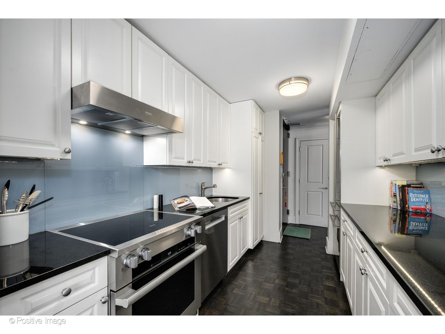 1310 North Ritchie Court, Unit 26C Chicago, IL 60610 - Photo 16 of 34 a kitchen with stainless steel appliances a sink a stove and cabinets