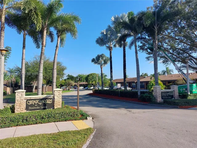 a view of a yard with a table and chairs
