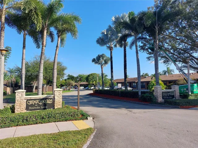a view of a yard with a table and chairs