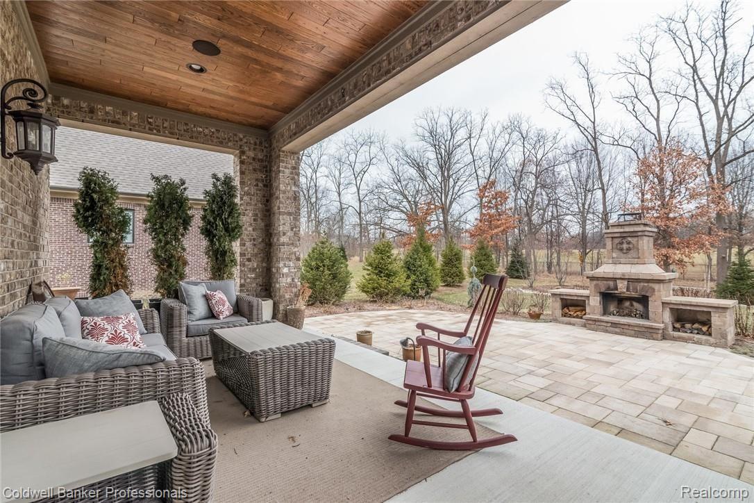 3762 Thatcher Drive Rochester, MI 48309 - Photo 65 of 76 Covered lanai and outdoor fireplace