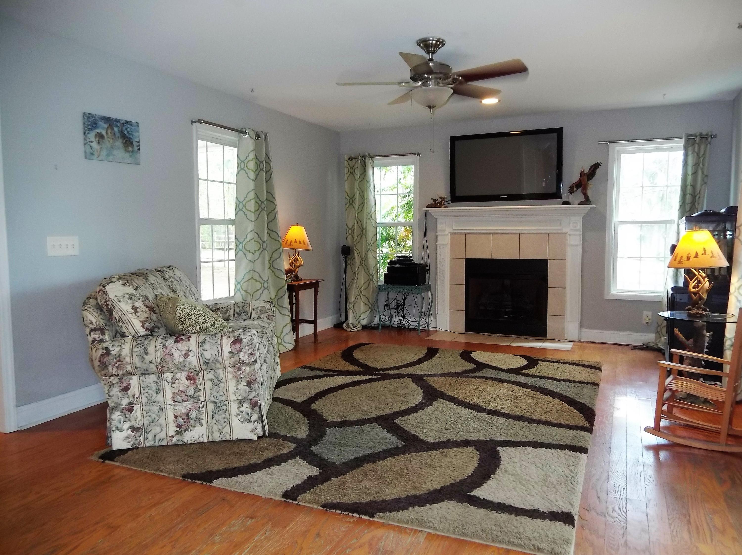 229 B Foxfire Road Aberdeen, NC 28315 - Photo 17 of 47 Large living room with windows all around.