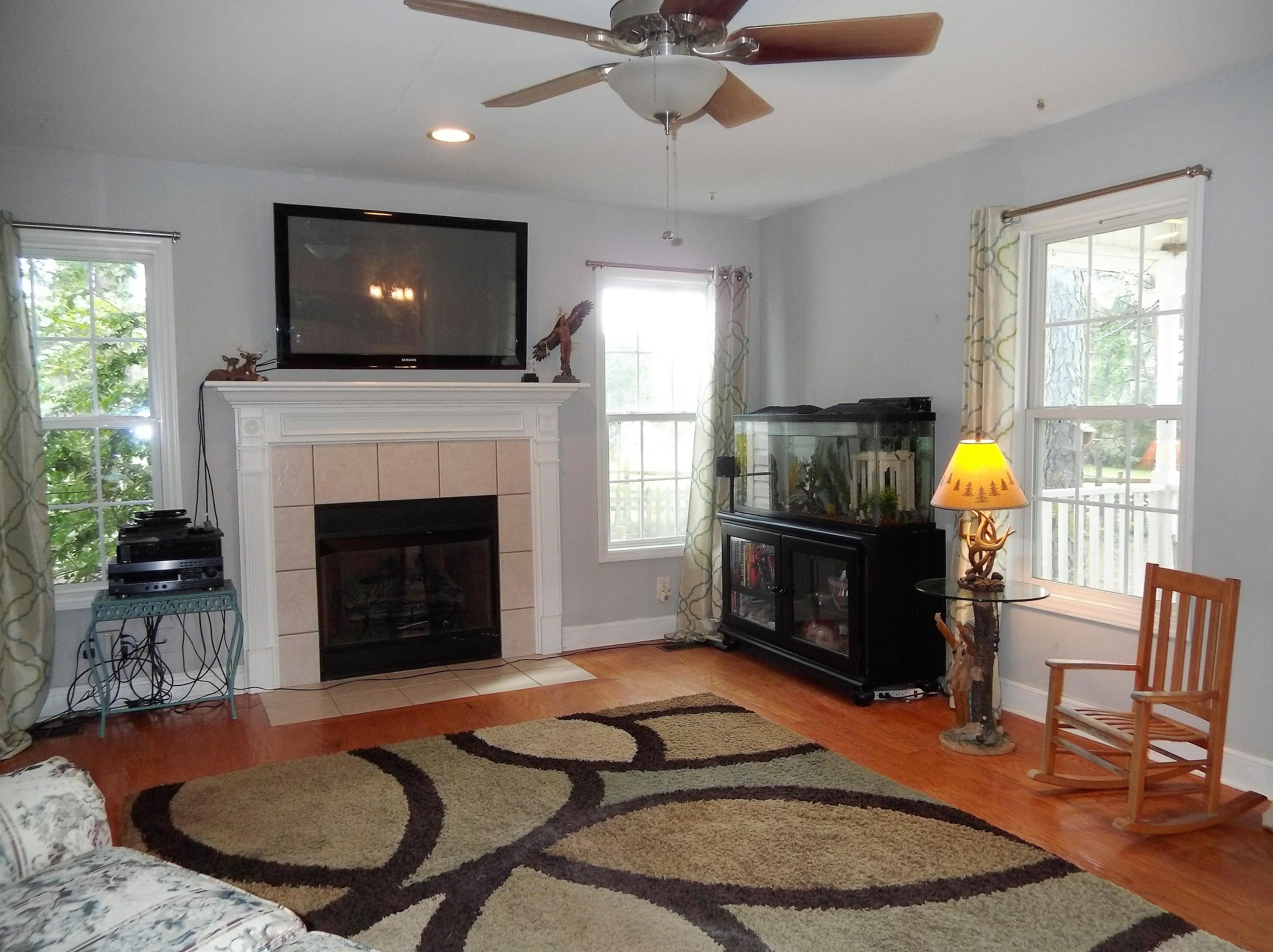 229 B Foxfire Road Aberdeen, NC 28315 - Photo 18 of 47 Gas log fireplace is ready for when nights get cooler.