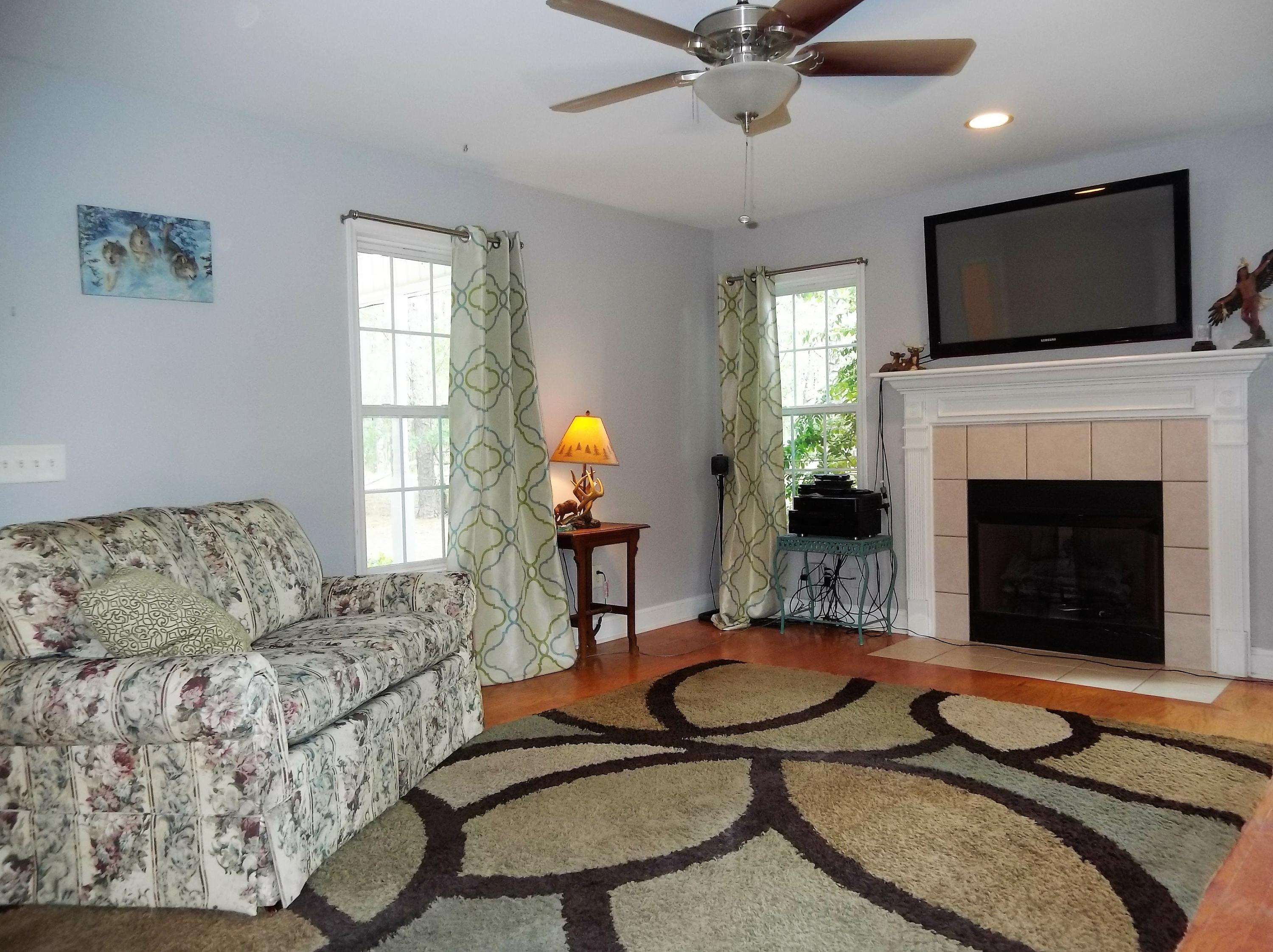 229 B Foxfire Road Aberdeen, NC 28315 - Photo 19 of 47 Wood floors, soft colors, time for a relaxing spot after working all day.