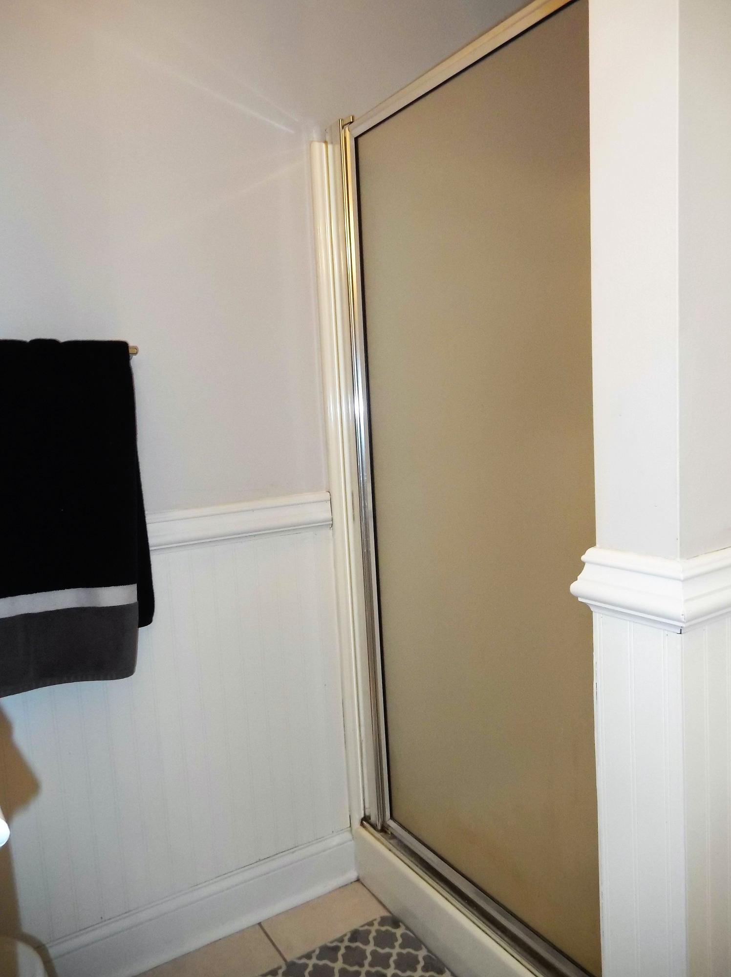 229 B Foxfire Road Aberdeen, NC 28315 - Photo 25 of 47 Stall shower tucked in while bath is accented by chair rail molding.