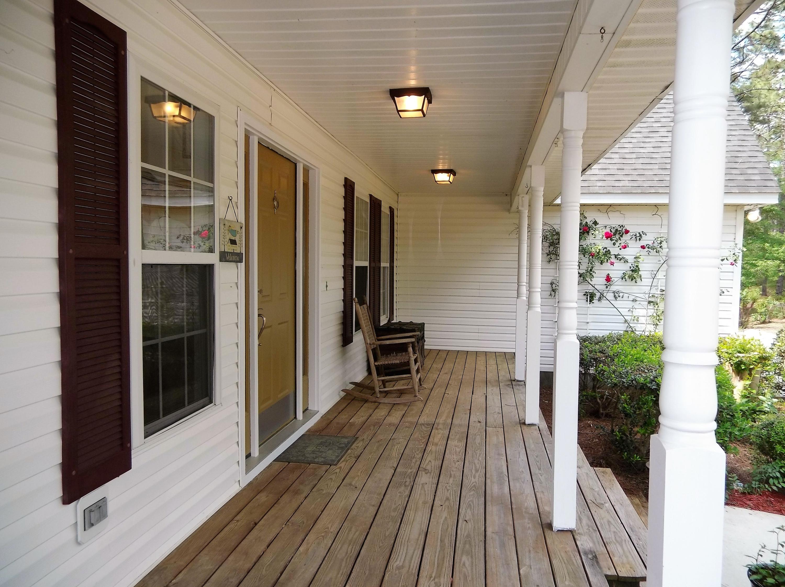 229 B Foxfire Road Aberdeen, NC 28315 - Photo 4 of 47 Fantastic farmhouse with wrap around porch tells everyone "welcome"
