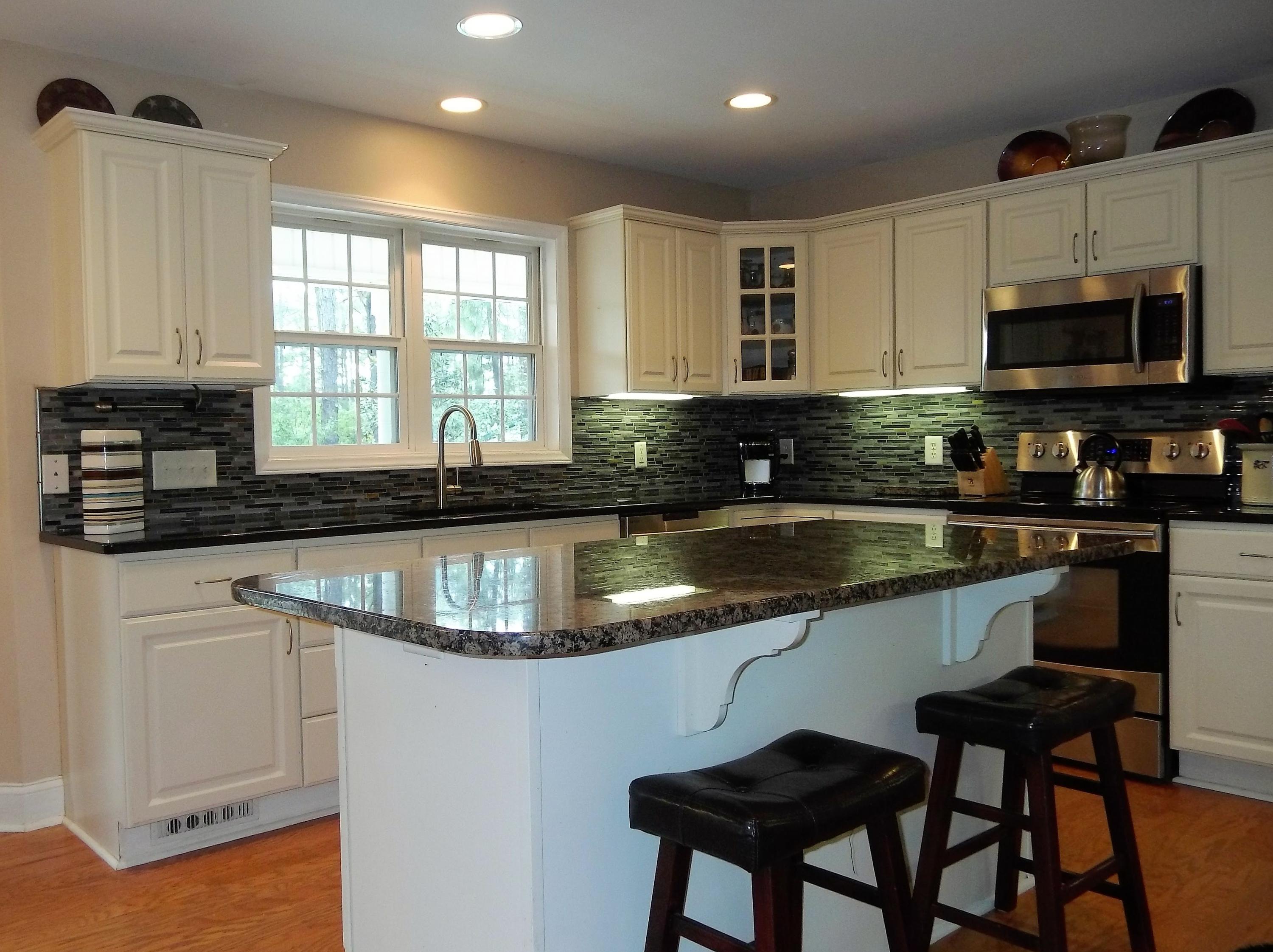 229 B Foxfire Road Aberdeen, NC 28315 - Photo 8 of 47 Open kitchen with island seating lets everyone gather and help at meal time.