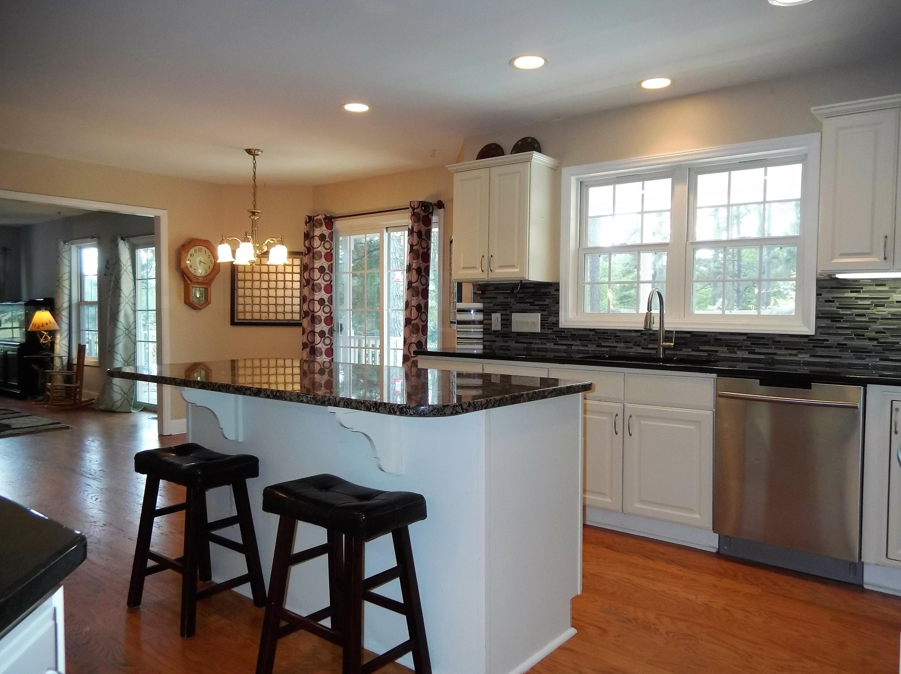 229 B Foxfire Road Aberdeen, NC 28315 - Photo 10 of 47 Kitchen is open to the eating area and overlooks the backyard.