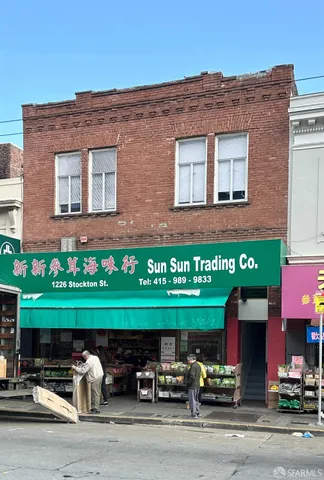 a front view of a building with garden