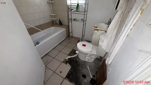a bathroom with a sink and toilet