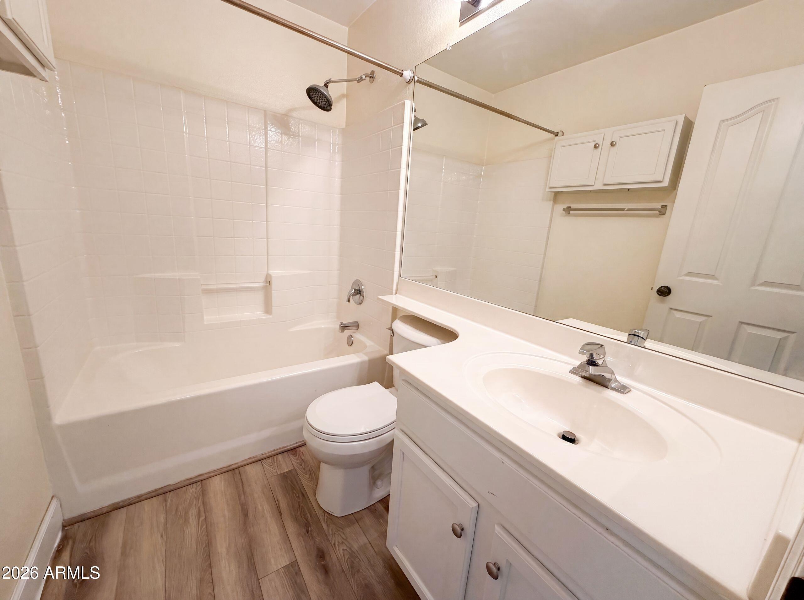 3951 East Timberline Road Gilbert, AZ 85297 - Photo 23 of 28 a bathroom with a sink toilet a shower and a mirror