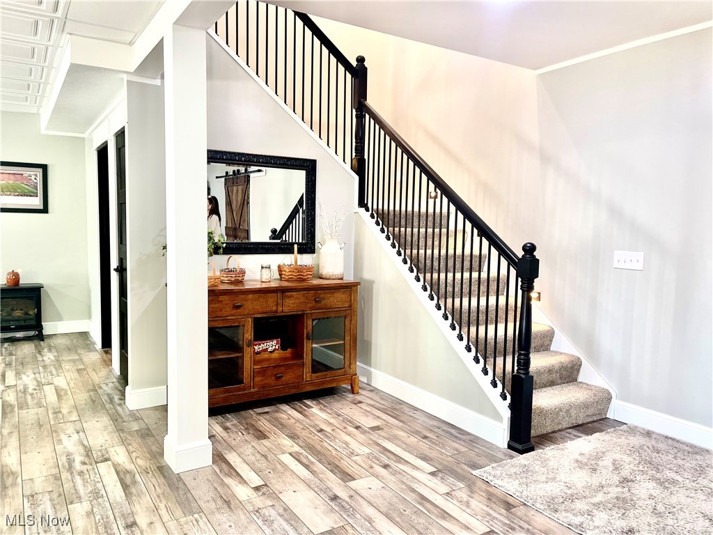 37250 Harry's Ridge Road Barnesville, OH 43713 - Photo 27 of 50 Staircase with hardwood / wood-style flooring and ornamental molding