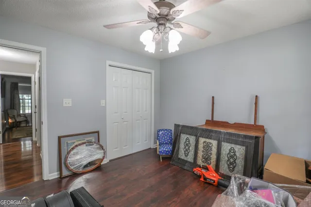 a view of hall way with furniture and bedroom