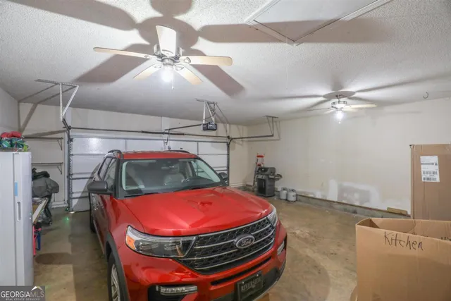 a room with pool table and wooden floor