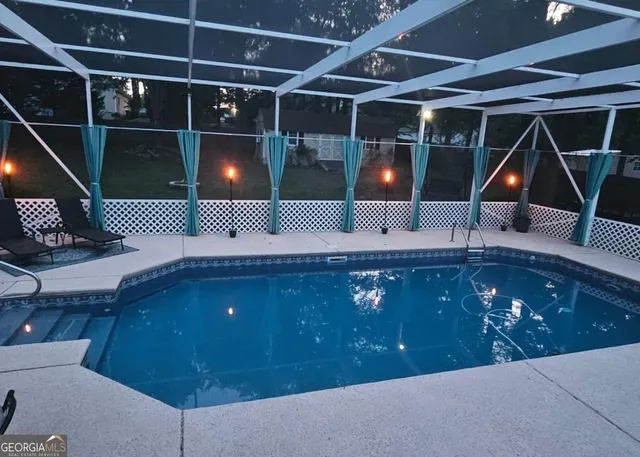 a bathroom with a sink a light fixture and a mirror
