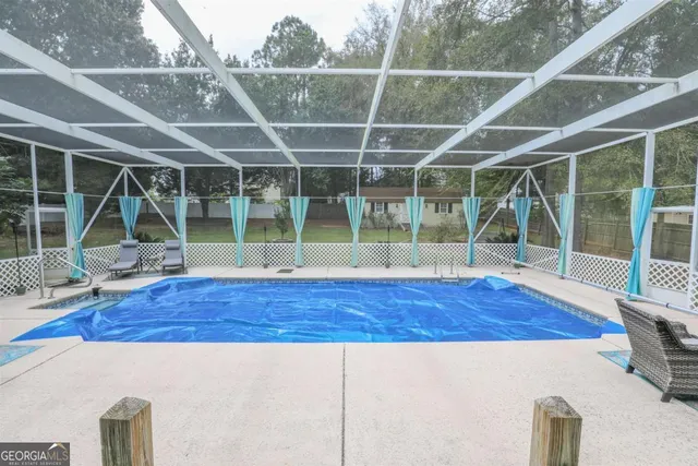 a view of outdoor space with wooden floor and windows