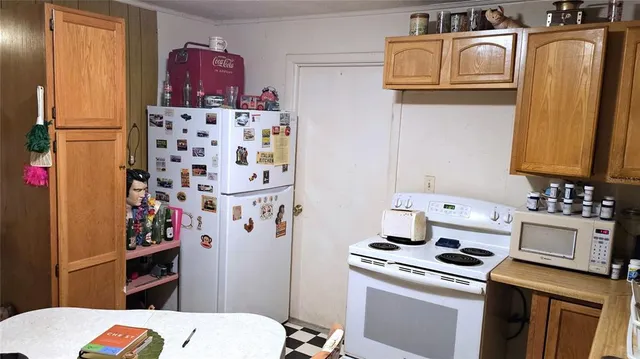 a kitchen with stainless steel appliances a stove a sink and cabinets